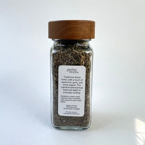 A glass spice jar with a wooden lid and a white label reading on a clean white background.